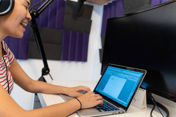 istock asian woman working on a laptop at the studio. 1196478503