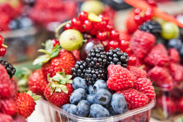 istock Colorful assorted mix of strawberry, blueberry, raspberry, blackberry in a plastic cup 1196478543