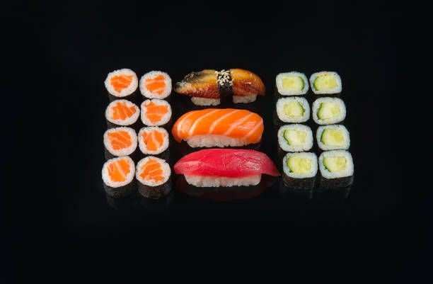 istock Big sushi rolls set served on black background 1196478761
