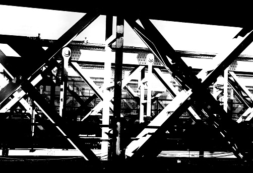A black and white photo of iron railway bridge