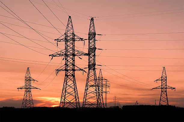 istock Electricity pylons and lines at dusk. 119648143