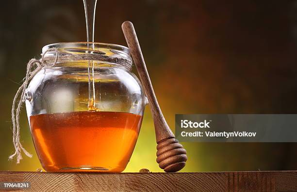 Pot Is Being Filled With Honey And A Drizzler Stock Photo - Download Image Now - Honey, Color Image, Cooking Pan