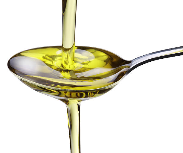 istock Olive oil flowing into the spoon. 119648383