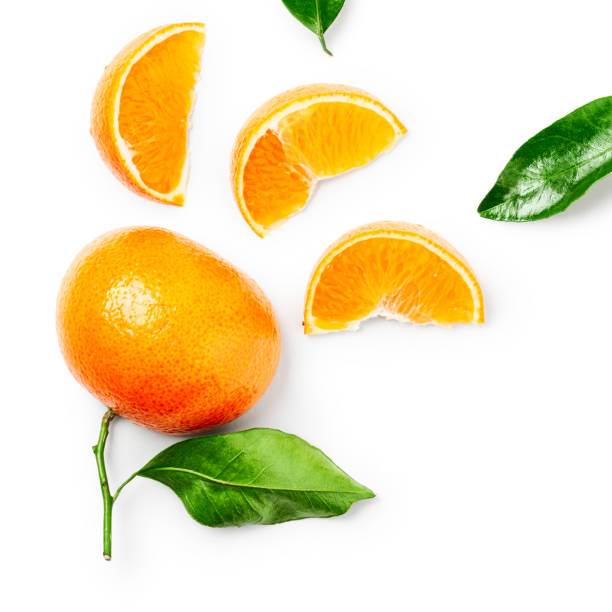 istock Clementine citrus fruit and citrus leaves composition 1196485273