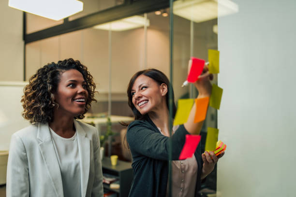 istock Laughing entrepreneurs people working on new project. 1196485636