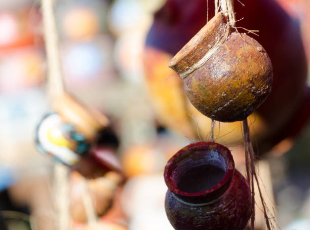 istock Mexican ceramic pots on ropes in pottery workshop, San Diego 1196485684