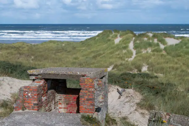 Old German bunker on the island Terschelling in the dunes nearby the North Sea in the North of the Netherlands
