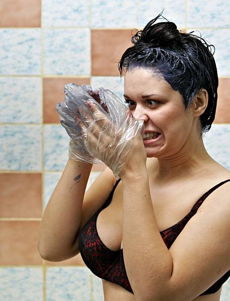 istock woman dyeing hairs 119648952