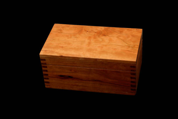 istock Cherry wood box with finger joints on a black background. 1196492201