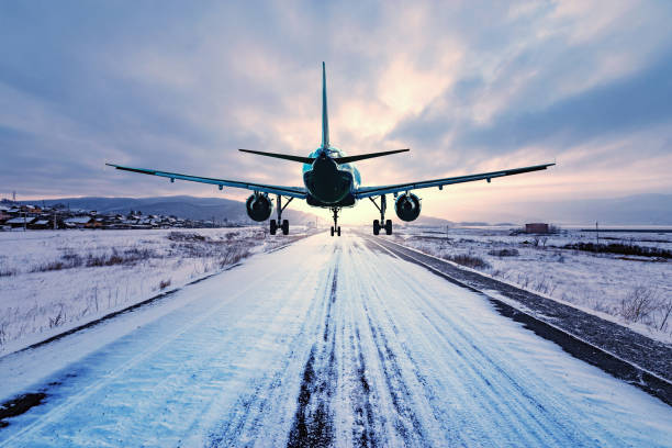 Landing of the passenger plane to the highway. Landing of the passenger plane to the highway at winter evening time. airports canada stock pictures, royalty-free photos & images