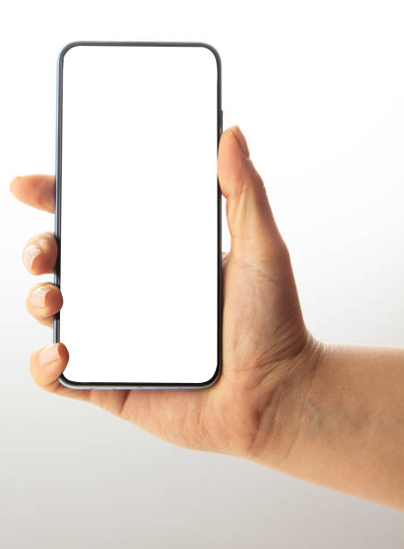 istock Hand holding black Smartphone with blank screen on white background 1196493098