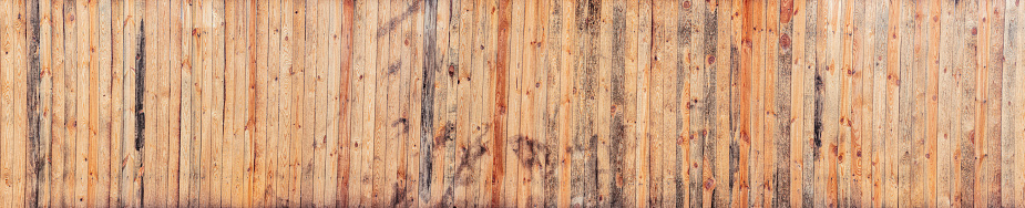 Surface of old wooden table, background with yellow boards with a distinct texture