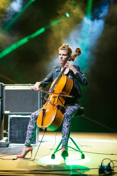 istock Young woman playing cello on the stage 1196495717