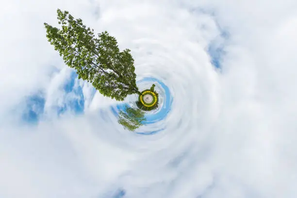 Planet earth with a trees and clouds. Circle effect