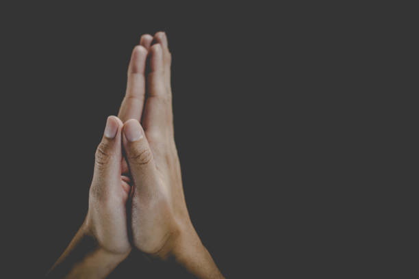 istock A woman is praying by her hands. Praying hands. 1196499077