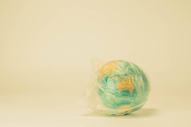 istock A globe in a plastic bag. Plastic and globe in the concept of the global environment from plastic. 1196499721
