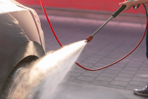 istock Woman washing a car 1196504074
