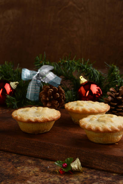 istock three mincemeat pies on wood cutting board 1196505719