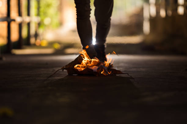 istock A man is stand behind the bonfire. 1196505861