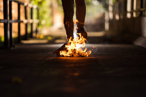 istock A man is stand behind the bonfire. 1196505871