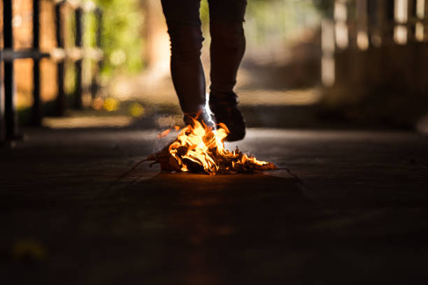 istock A man is stand behind the bonfire. 1196505934