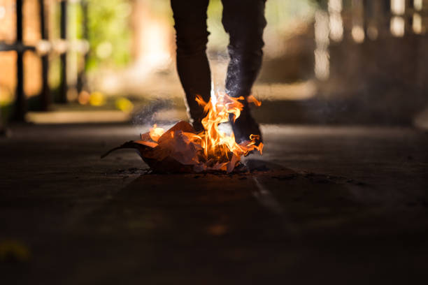 istock A man is stand behind the bonfire. 1196505935