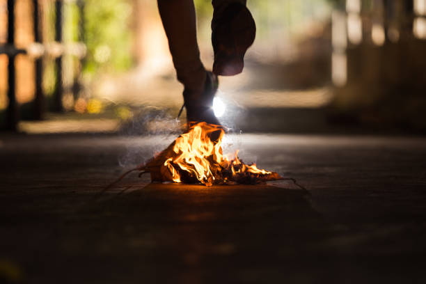 istock A man is walk across the bonfire. 1196505949