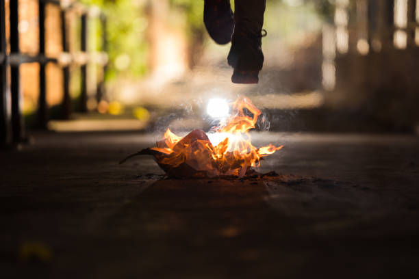 istock A man is jump cross the bonfire. 1196506090