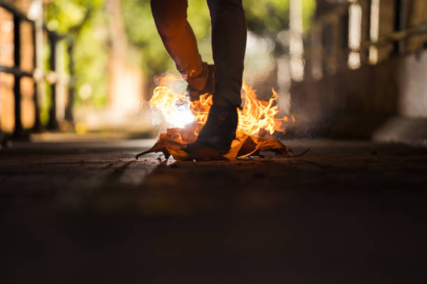 istock A man is walk across the bonfire. 1196506642