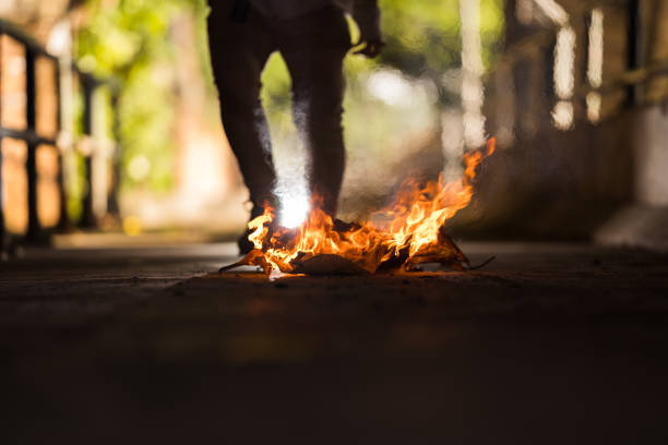 istock A man is stand behind the bonfire. 1196506697