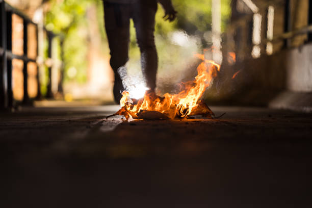 istock A man is stand behind the bonfire. 1196506715