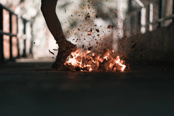 istock A man is kick the bonfire. 1196506716