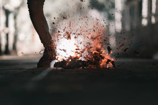 istock A man is kick the bonfire. 1196506780