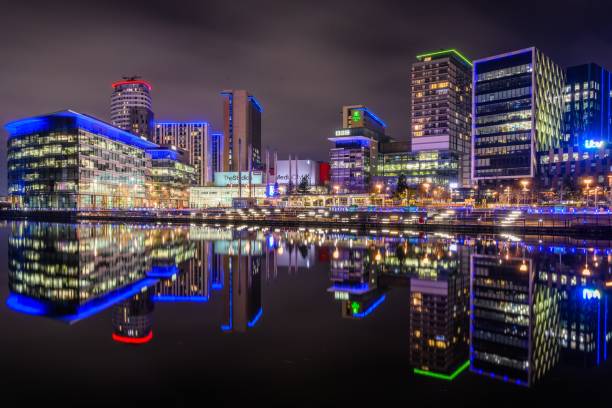 istock Salford Quays media city water reflection 1196507877