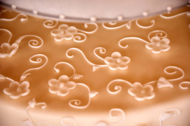 Detail shot of decorated wedding cake texture. Shallow depth of field / selective focus.