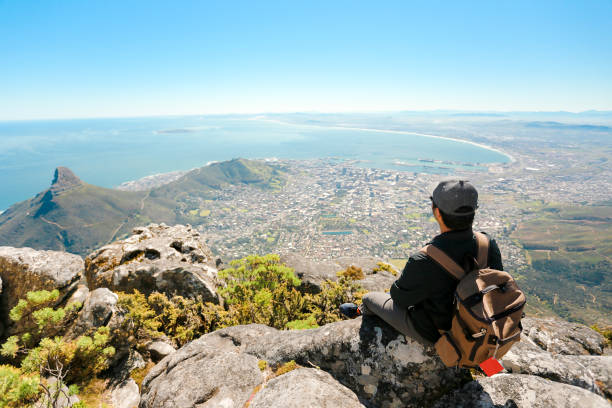 istock a man taking in view on Table Mountain, Cape Town 1196509957