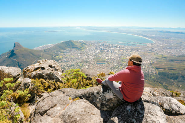 istock a man taking in view on Table Mountain, Cape Town 1196509966
