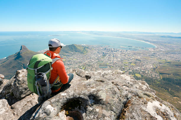 istock a man taking in view on Table Mountain, Cape Town 1196509968