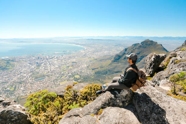 istock a man taking in view on Table Mountain, Cape Town 1196510011