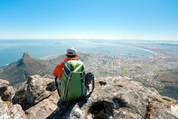 istock a man taking in view on Table Mountain, Cape Town 1196510013