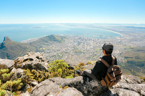 istock a man taking in view on Table Mountain, Cape Town 1196510053