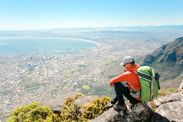 istock a man taking in view on Table Mountain, Cape Town 1196510059