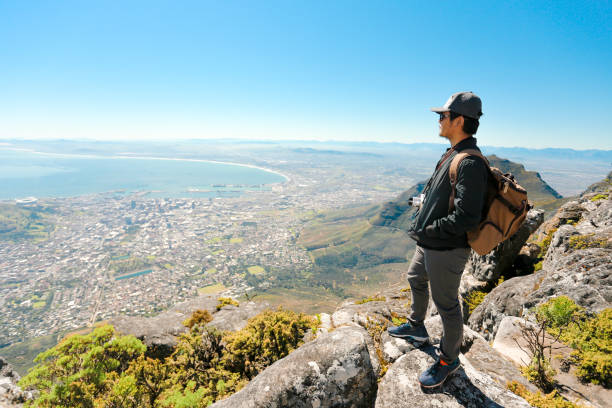 istock a man taking in view on Table Mountain, Cape Town 1196510087