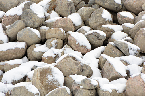 Pile of boulder rocks dusted with snow