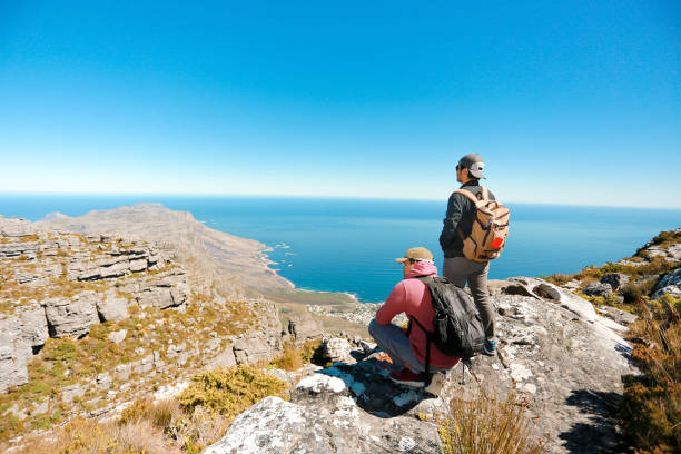 istock a man taking in view on Table Mountain, Cape Town 1196510154