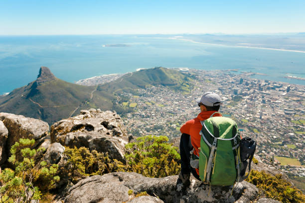 istock a man taking in view on Table Mountain, Cape Town 1196510167