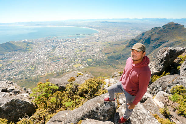 istock a man taking in view on Table Mountain, Cape Town 1196510173