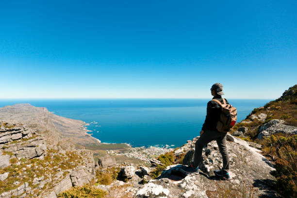 istock a man taking in view on Table Mountain, Cape Town 1196510208