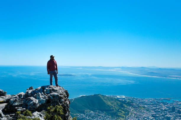 istock a man taking in view on Table Mountain, Cape Town 1196510248