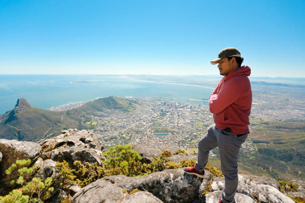 istock a man taking in view on Table Mountain, Cape Town 1196510262